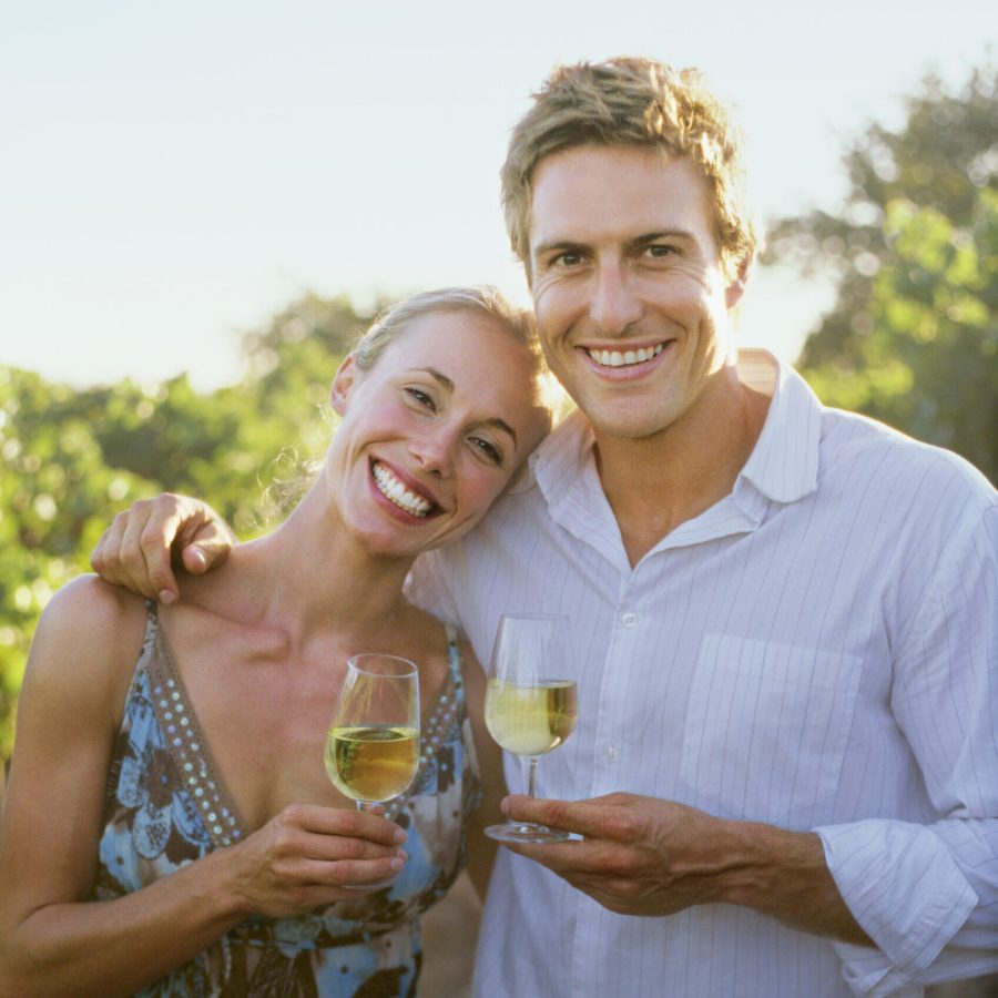 Couple holding glasses of wine